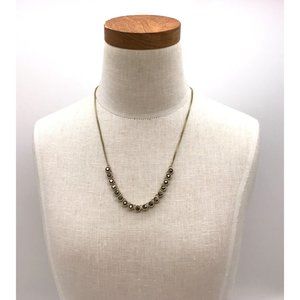 Necklace brushed gold finish with black gems and a adjustable chain